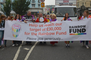 Councillor Bill Randall leads the Pride 2013 parade with his wife Heather and former councillor Paul Elgood