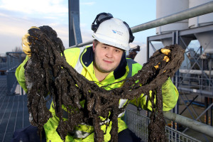 A Southern worker with rag retrieved from the sewers. Picture by Ciaran McCrickard of Connors