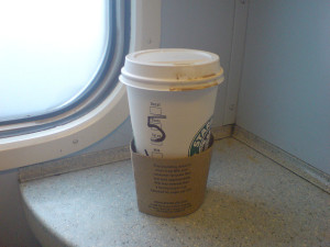 takeaway coffee on a train by Nico Hogg on Flickr