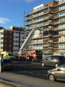 Firefighters helped paramedics bring a patient down to a waiting ambulance on Hove seafront