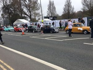 The Marathon caravan of Minis heads past Preston Park heralding the arrival of the elite runners.  Picture by Tim Hodges.